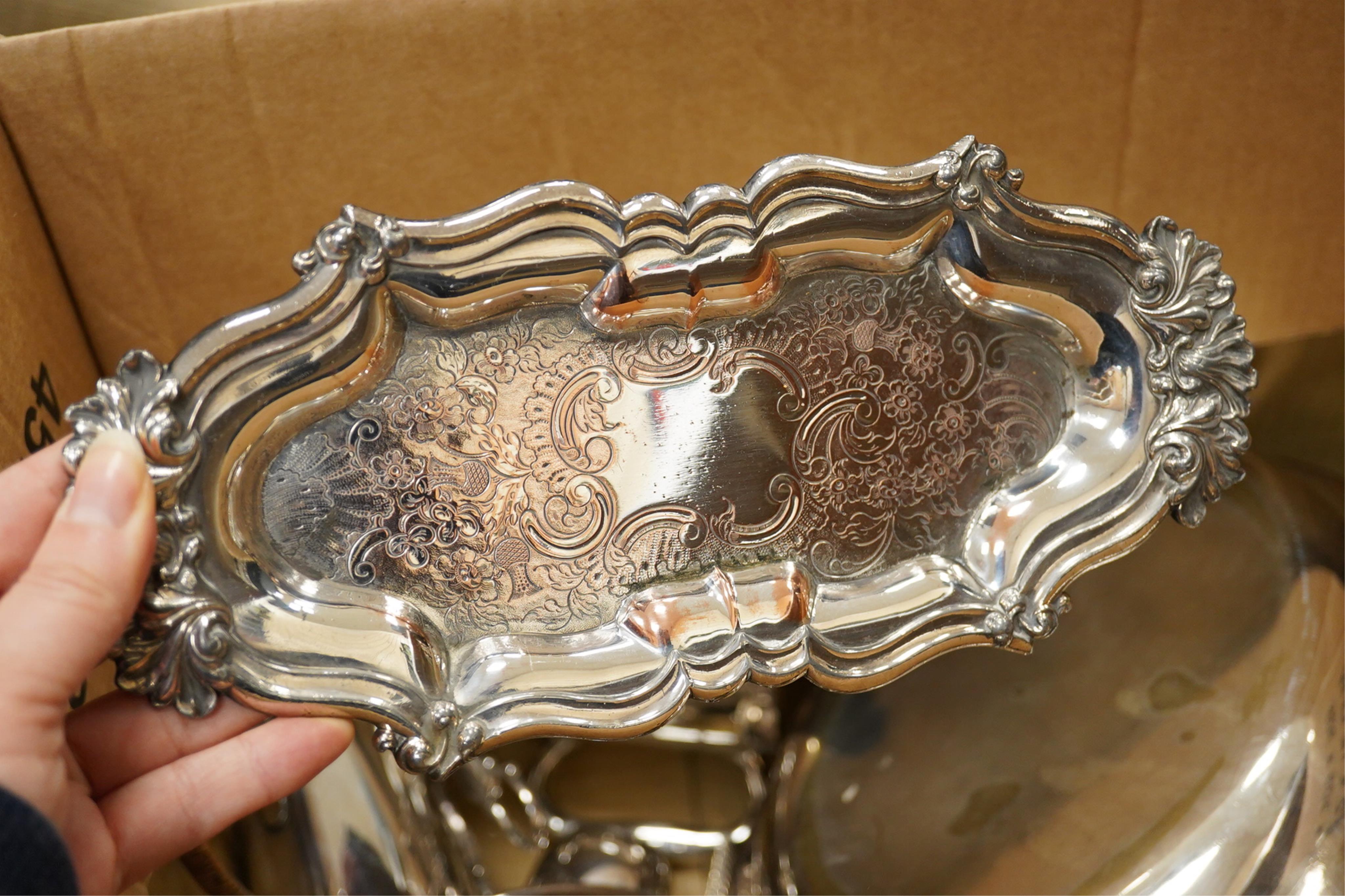 A quantity of assorted plated ware including entrée dishes, toast racks, salvers, pair of coasters and a coromandel wood tantalus (no key) etc.